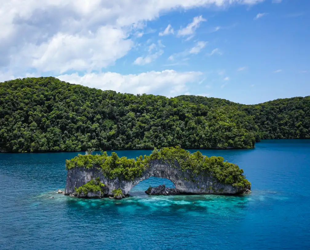 aerial photo of "the arch" a natural arch in Palau's Rock islands