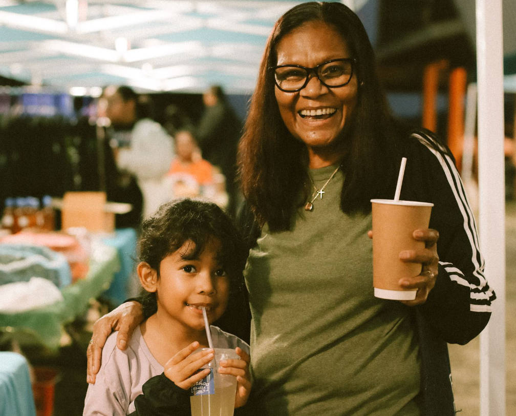 Mother and child having fun at the 680 Night Market in Palau