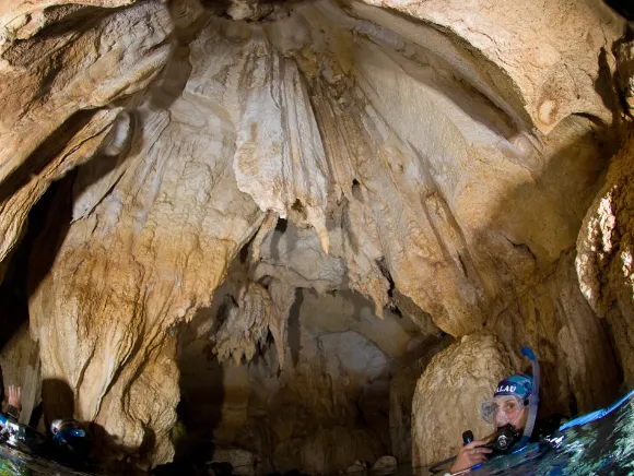 scuba diver on the surface in Chandelier Cave a dive site in Palau